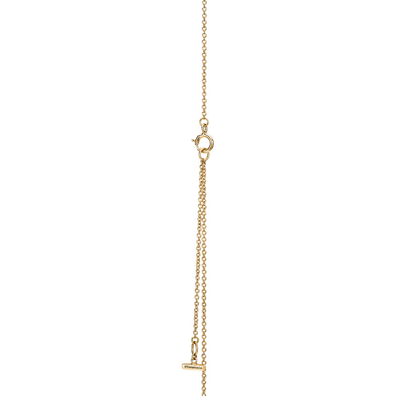 Tiffany & Co. Tiffany T Colgante circular de diamantes y nácar de oro amarillo Oferta especial de fábrica