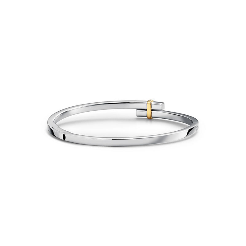 Tiffany & Co. Tiffany Edge Brazalete Hinged Bypass en platino y oro amarillo con diamantes Outlet online