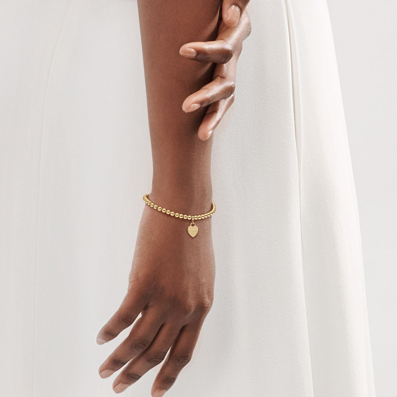 Tiffany & Co. Return to Tiffany™ Pulsera de cuentas con insignia de corazón en oro amarillo Envío gratis