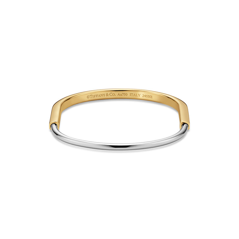 Tiffany & Co. Tiffany Lock Brazalete estrecho de oro amarillo y blanco Liquidación