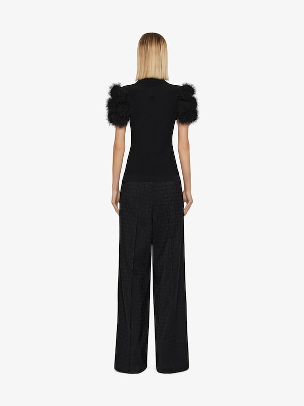 Givenchy Slim fit polo in knit with pompoms Solo queda un día