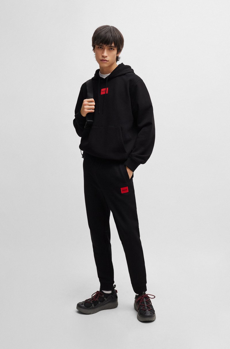 Hugo Boss Pantalones de chándal en felpa de algodón con etiqueta con logo roja Ventas relámpago