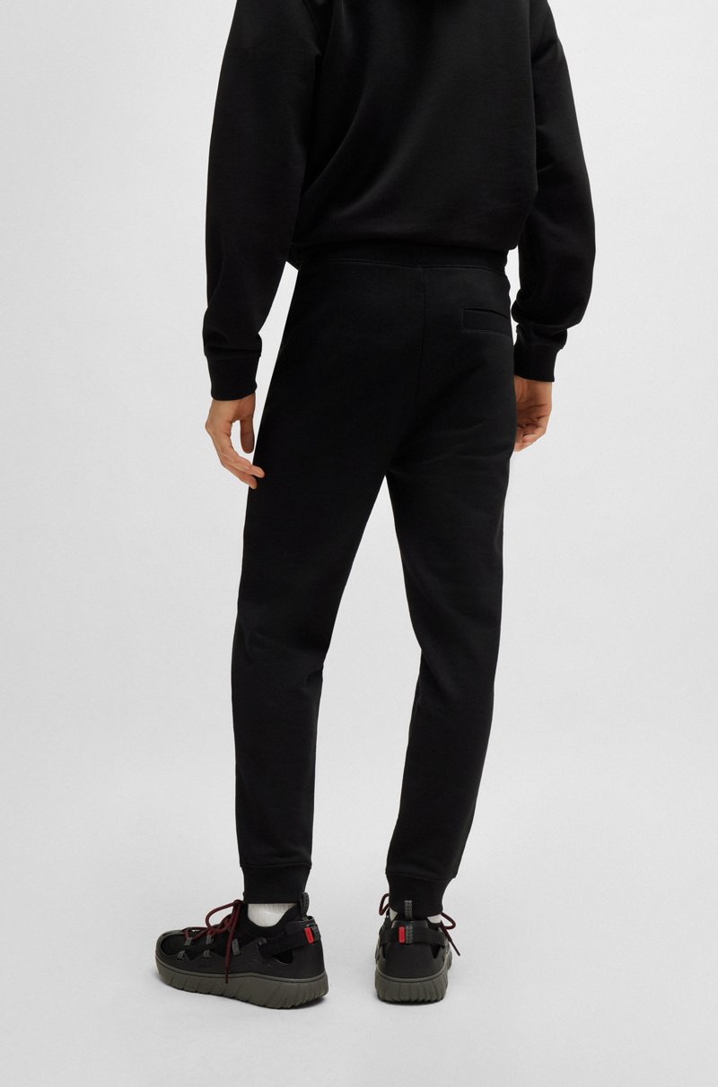 Hugo Boss Pantalones de chándal en felpa de algodón con etiqueta con logo roja Ventas relámpago