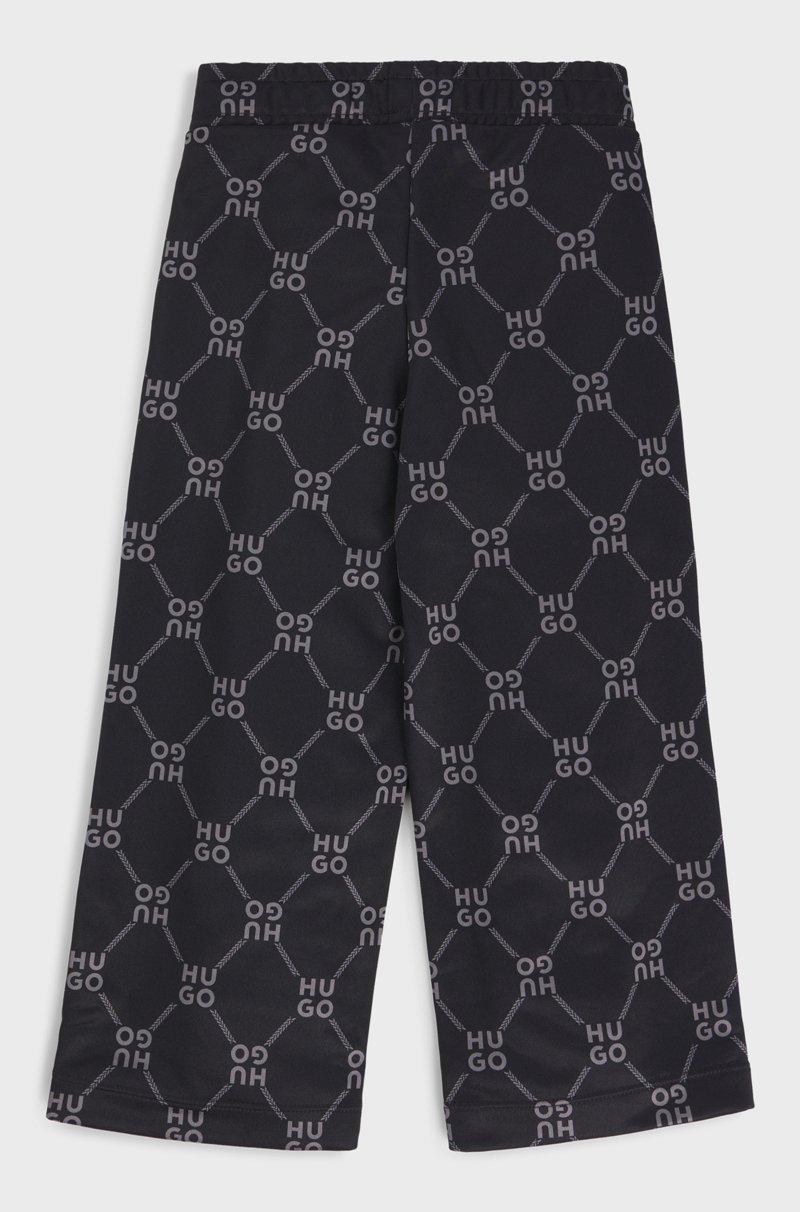 Hugo Boss Pantalones de chándal loose fit para niños con logo apilado estampado Venta caliente