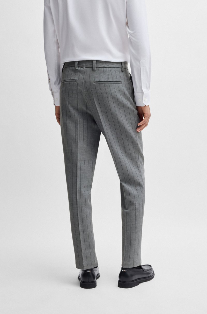 Hugo Boss Pantalones slim fit en tejido elástico con raya diplomática Outlet online