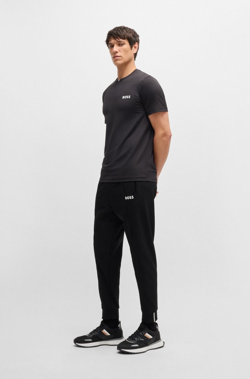 Hugo Boss Pantalones regular fit en tejido de gabardina elástico con detalle de logo En línea