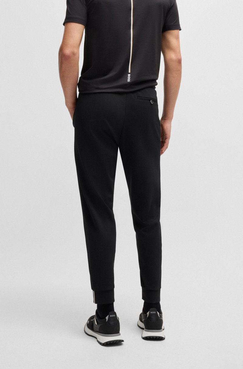 Hugo Boss Pantalones regular fit en tejido de gabardina elástico con detalle de logo En línea