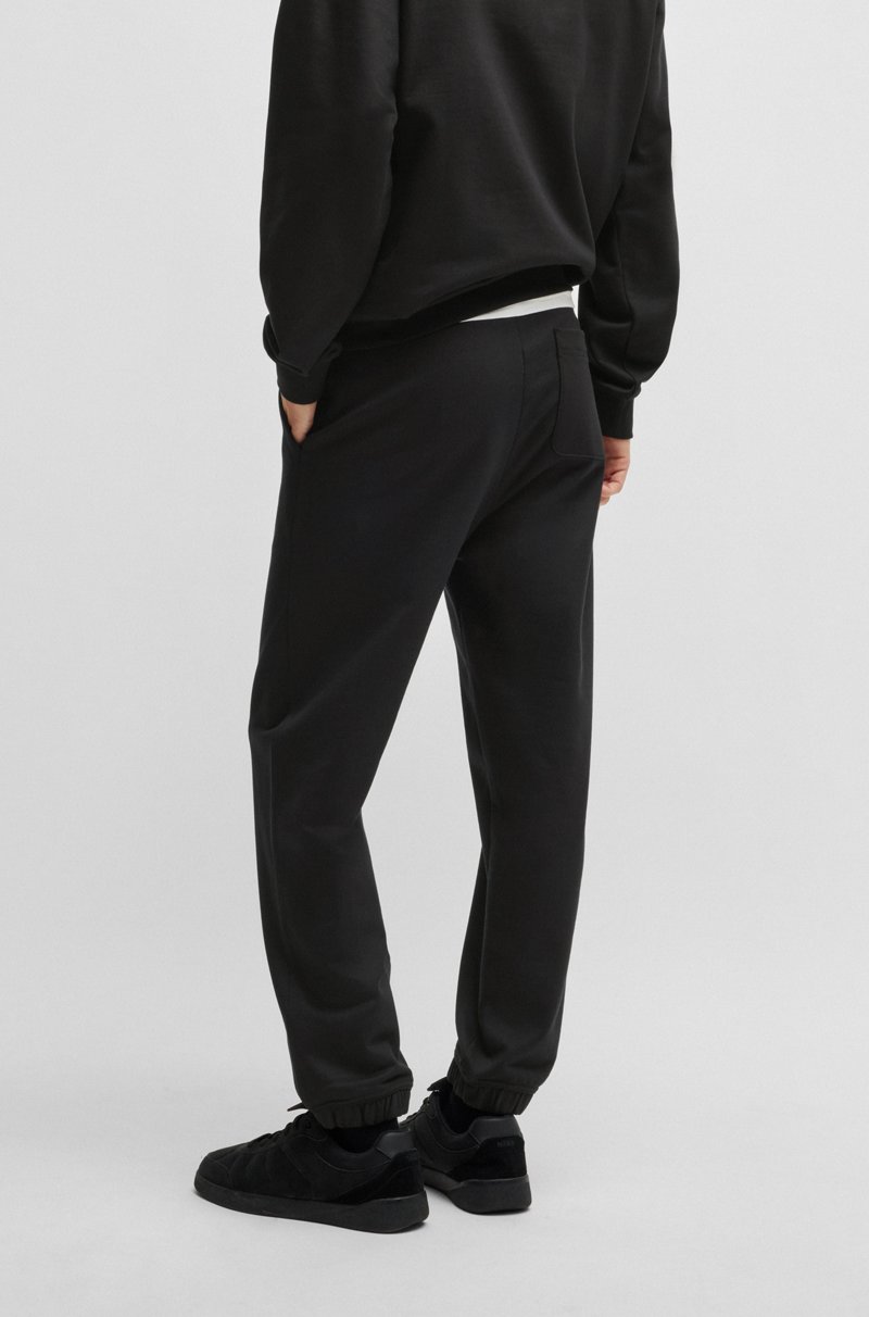 Hugo Boss Pantalones de chándal en felpa de algodón con logo ahumado Ofertas