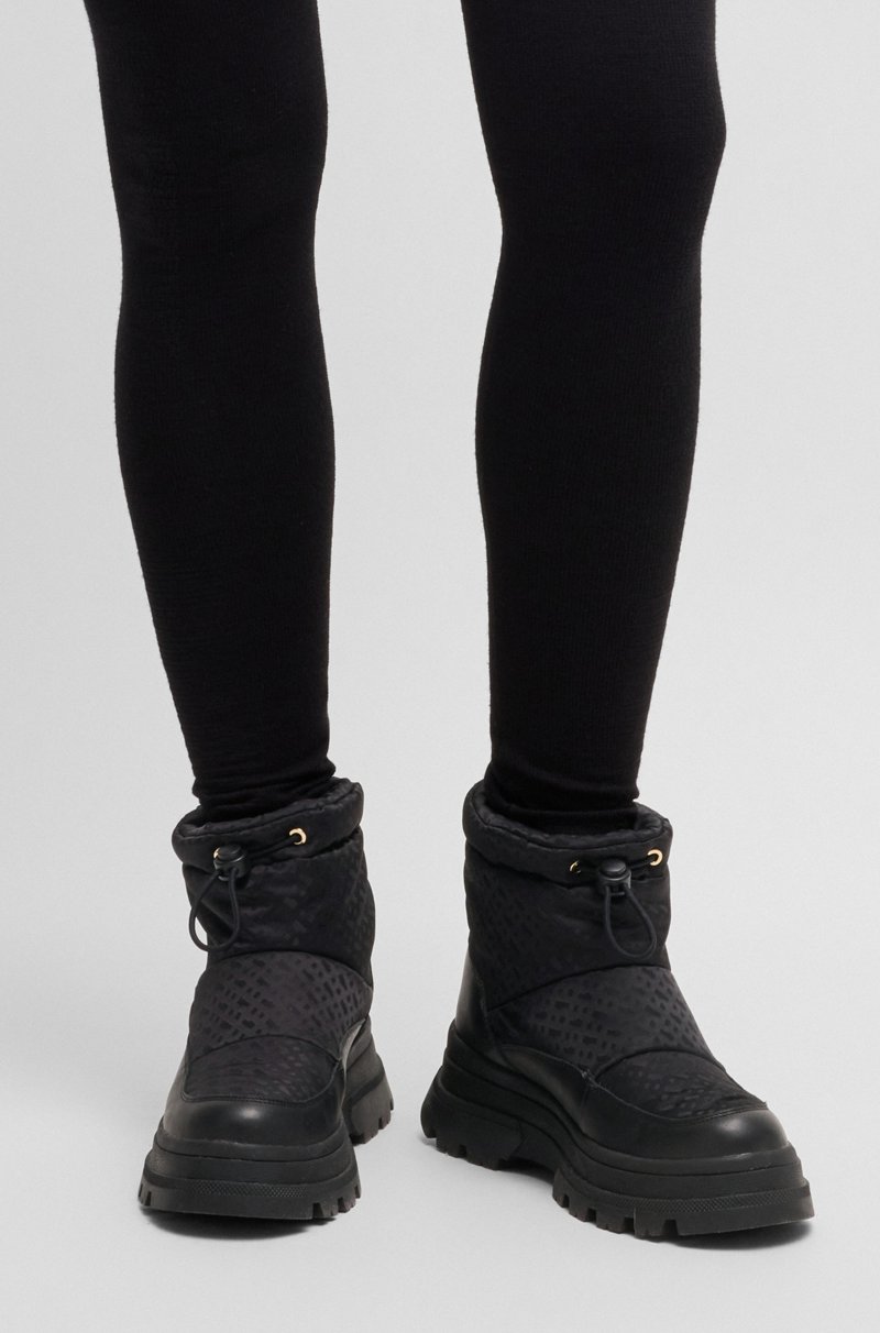 Hugo Boss Botas slim fit con motivo de monogramas y apliques de piel Último día