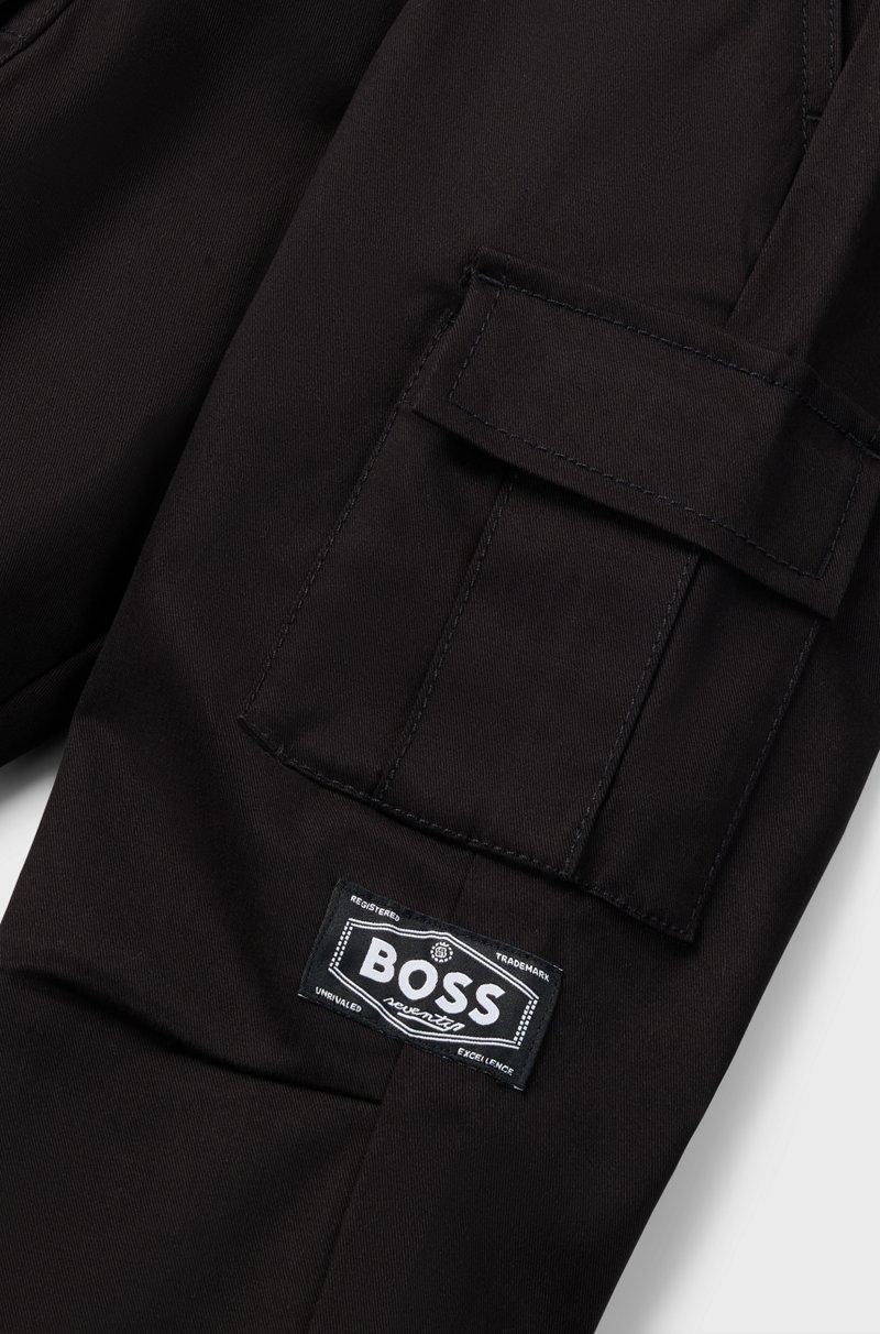 Hugo Boss Pantalones tapered fit en sarga de algodón elástico para niños Envío internacional gratuito